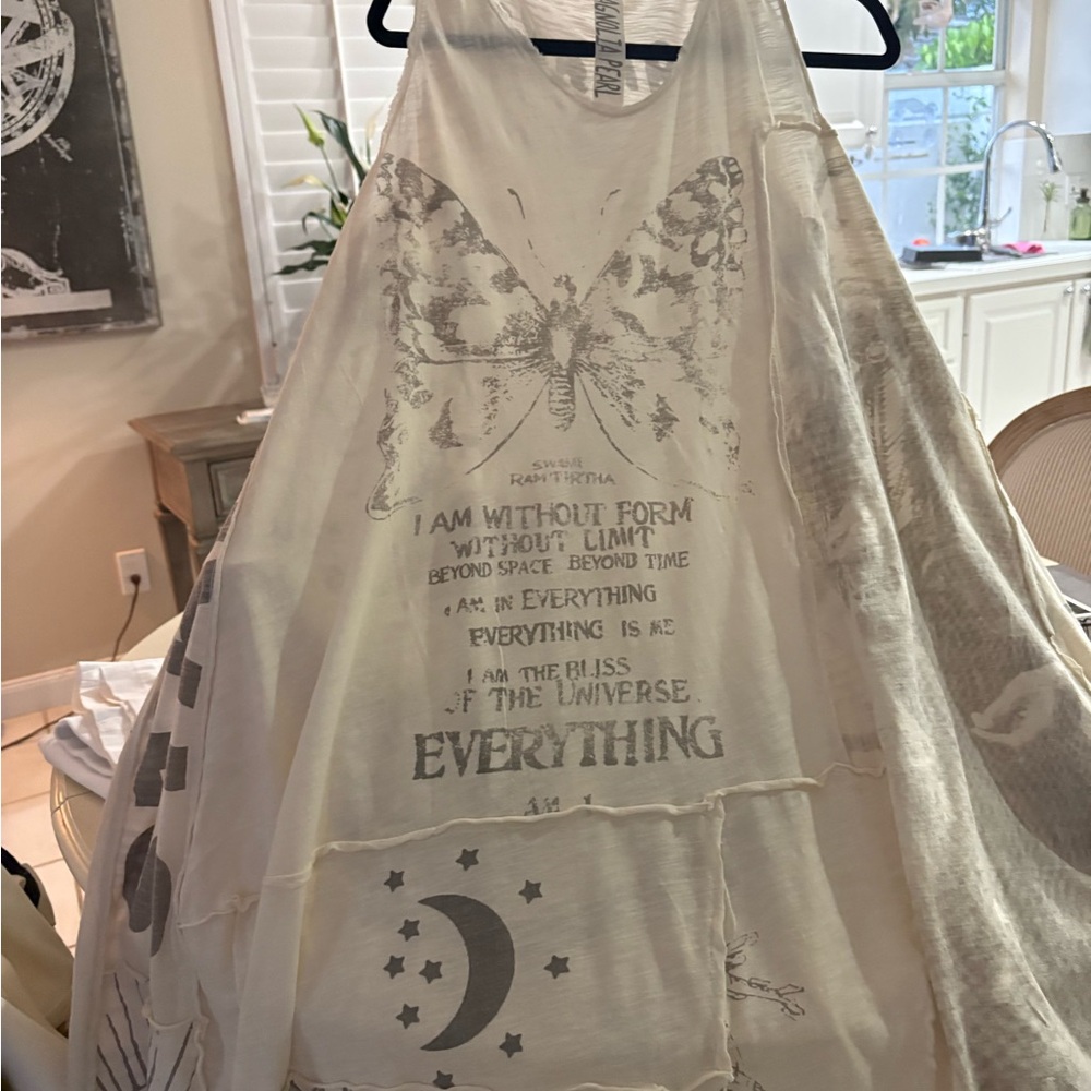 Long Magnolia Pearl dress with butterfly and text graphics.